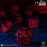 Dice with 'The Losers Club' design on a dark background, featuring HBO's 'Welcome to Derry' logo.