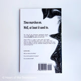 Back cover of a book with text and a barcode on a white background