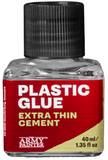 Bottle of Plastic Glue Extra Thin Cement by The Army Painter on a white background