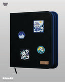 Black binder with colorful patches on a gray background