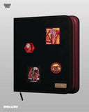 Black and red binder with embroidered patches on a gray background