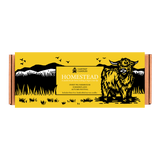Yellow and black box with a bull illustration and 'Cantrip Candles Homestead' branding.