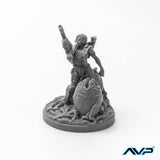 Gray miniature figure with a weapon on a white background, featuring the AVP logo.