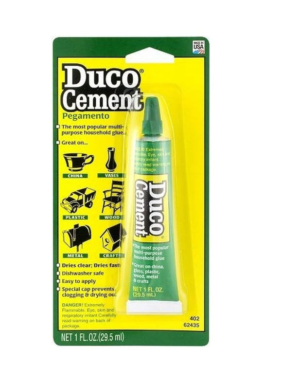 Duco Cement packaging with a green tube on a yellow background