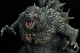 Monster toy figure with detailed texture and open mouth on a black background