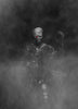 Ghostly figure with red eyes and a weapon in a dark, smoky environment