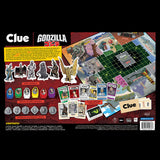 Clue Godzilla board game packaging with game pieces and cards on a red background