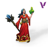 Figurine of a character in a red dress holding a green leaf and a staff with a blue crystal on a white background.