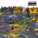 Board game setup with 'Masters of the Universe Battleground' theme, featuring a dinosaur-like creature and landscape elements.