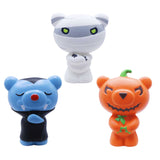 Three Halloween-themed figurines on a white background