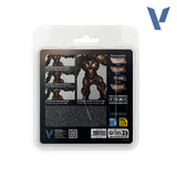 Back view of a packaged action figure set in a clear blister pack on a white background, showing character art, contents list, and small logos.