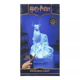 Packaging box for the Harry Potter Patronus Light, featuring a blue and gold design with an illustration of the glowing stag and text indicating wand control.