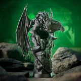 Dragon statue on a rocky surface with a green background
