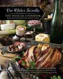 Cookbook titled 'The Elder Scrolls: The Official Cookbook' with food and wine on a table.
