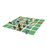 Board game setup with green tiles and animal figurines on a white background