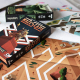 Maze-Scape board game boxes with game pieces on a table