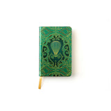 Green notebook with hot air balloon design on a white background