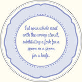A round decorative plate or sign with a scalloped light blue border and a cream center, featuring the phrase 'Eat your whole meal with the wrong utensil, substituting a fork for a spoon or a spoon for a knife.' in blue script.