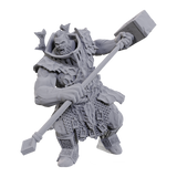 Gray warrior figurine with armor and great hammer on a white background