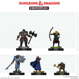 Four miniature figures from Dungeons & Dragons Heroclix on a white background with measurement scale.