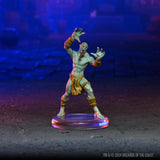 Fantasy figurine on a clear base with a dark background