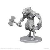 Unpainted monster figurine with axe on a white background