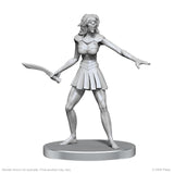 Unpainted miniature figure of a character holding a sword on a white background