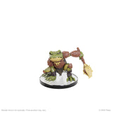 Toy figure of a creature with green skin and brown limbs on a white background