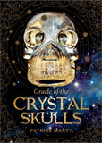 Book cover of 'Oracle of the Crystal Skulls' with a metallic skull design on a dark background.