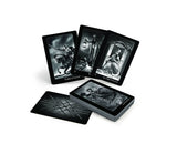 Set of black and white tarot cards with intricate designs on a white background