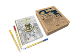 Harry Potter-themed coloring book with pencils on a white background