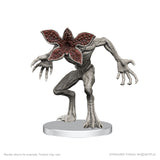 Statue of a creature with a flower-like head on a white background