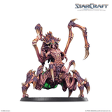 A painted StarCraft tabletop miniature of a multi-legged alien spider-like creature on a black base, shown against a white background with StarCraft branding in the top right.