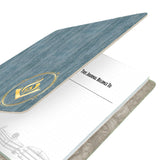 Journal with blue cover and gold emblem on a white background