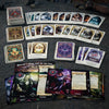 Collection of fantasy trading cards on a dark surface