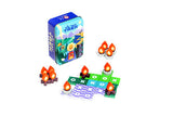 Board game set with candles and a tin box on a white background