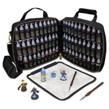 Art supply set with open case containing bottles and tools on a white background