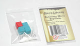 Two colorful tokens in a clear plastic bag with a 'Fire in the Library' product label.