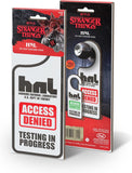 Stranger Things-themed door signs with 'Access Denied' and 'Testing in Progress' text on packaging.