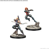 Two miniature figures on stands with a white background