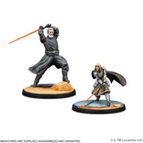 Two miniature figures on stands with a white background