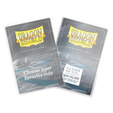 Two Dragon Shield card protectors for board games on a white background