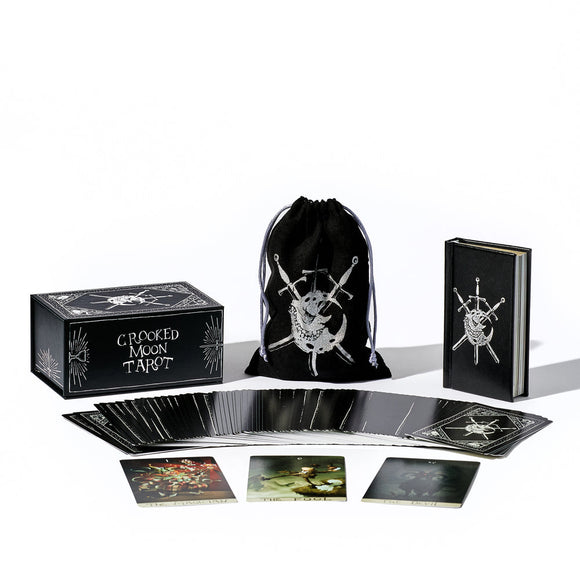 Crooked Moon Tarot set with tarot cards, box, and drawstring bag on a white background