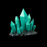 Green crystal-like structure on a black background