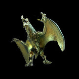 Metallic dragon figurine on a black background