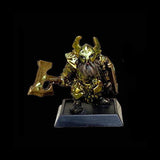 Metallic fantasy figurine with armor and helmet on a black background