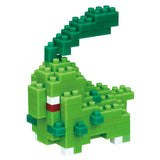 Green dinosaur toy made of interlocking bricks on a white background