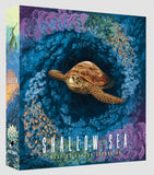 Board game box for 'Shallow Sea' with a turtle illustration on a colorful underwater background