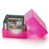 Pink card holder with trading cards on a white background