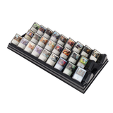 Collection of trading cards on a display stand with a white background